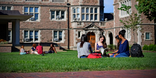 Students relax on Brookings Quad at Washington University