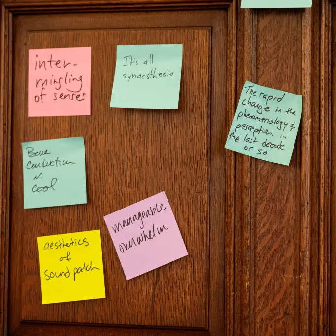 A series of post-it notes on a wall